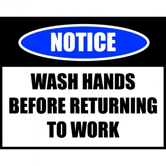 COVID-19 skilt med teksten "Notice - Wash Hands Before Returning to Work"