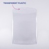 Billedet viser et klart, gennemsigtigt plastikdæksel med en afrundet top. Der er en etiket, der peger på det, hvor der står 'TRANSPARENT PLASTIC.'