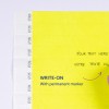Billedet viser en lys gul side med instruktioner om at skrive på den med en permanent marker. Der er felter til tekst, inklusive 'Your text here' på engelsk og 'Votre texte ici' på fransk.