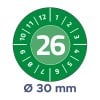 Billedet viser en grøn cirkulær enhed med tallet 26 tydeligt vist i midten, omgivet af tal fra 1 til 12 og yderligere markeringer. Nederst står der 'Ø 30 mm', hvilket angiver en diameter.